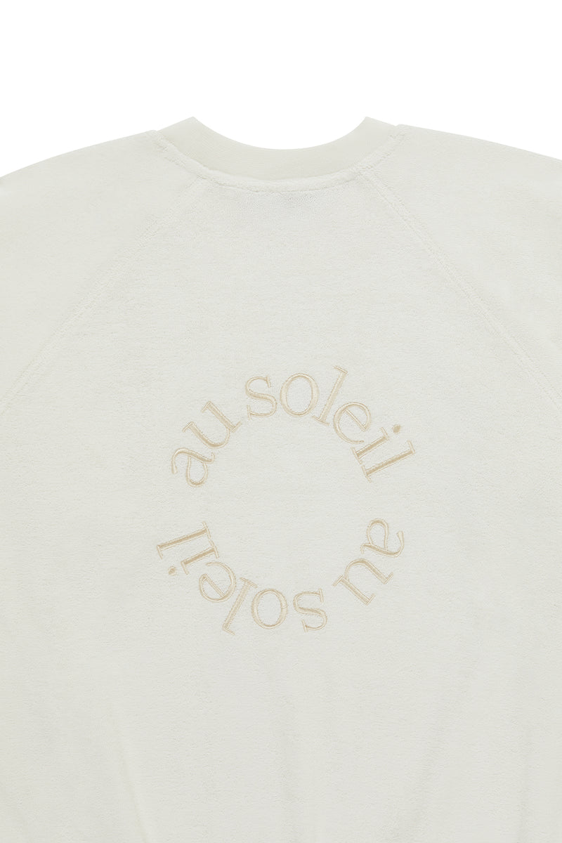 Flat Lay Image of the Terry Sweatshirt of the Au Soleil embroidery detail in ton sur ton