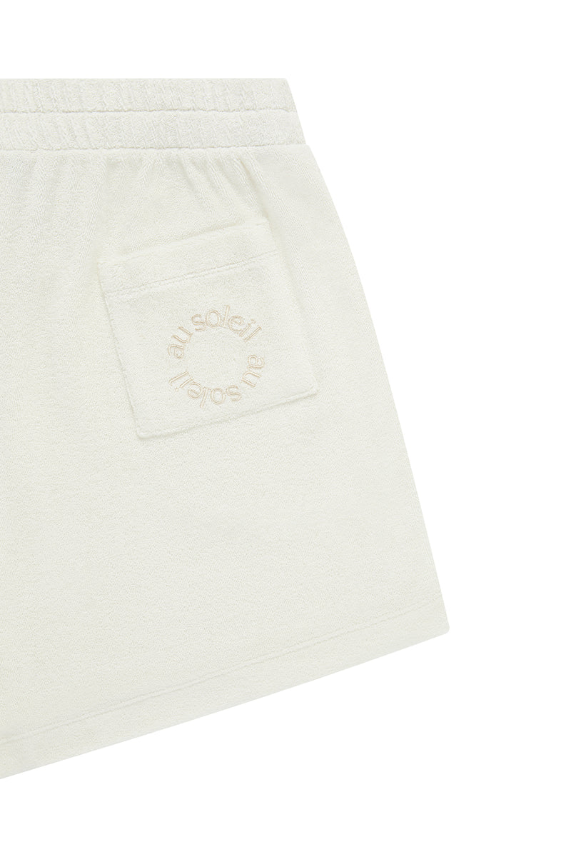 Flat Lay Image of the Terry Shorts with the back pocket detail with au soleil embroidery in ton sur ton